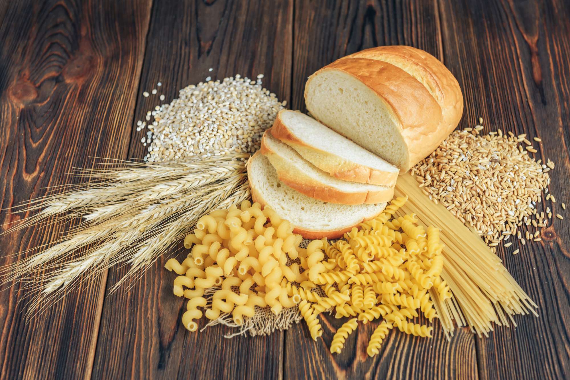 foods-high-carbohydrate-wooden-background-loaf-pasta-pearl-barley-oats.jpg