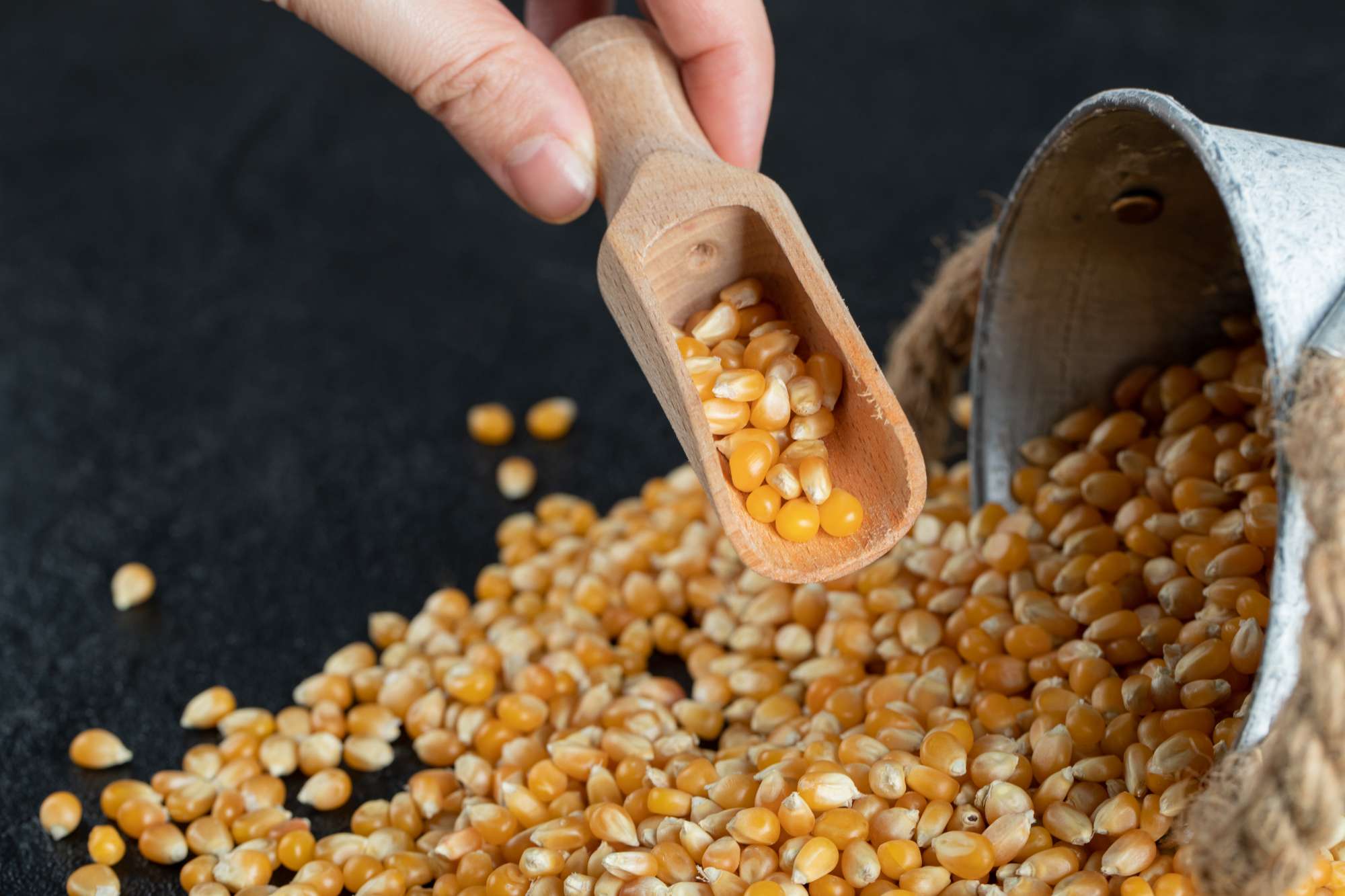 raw-popcorn-with-wooden-spoon-dark.jpg