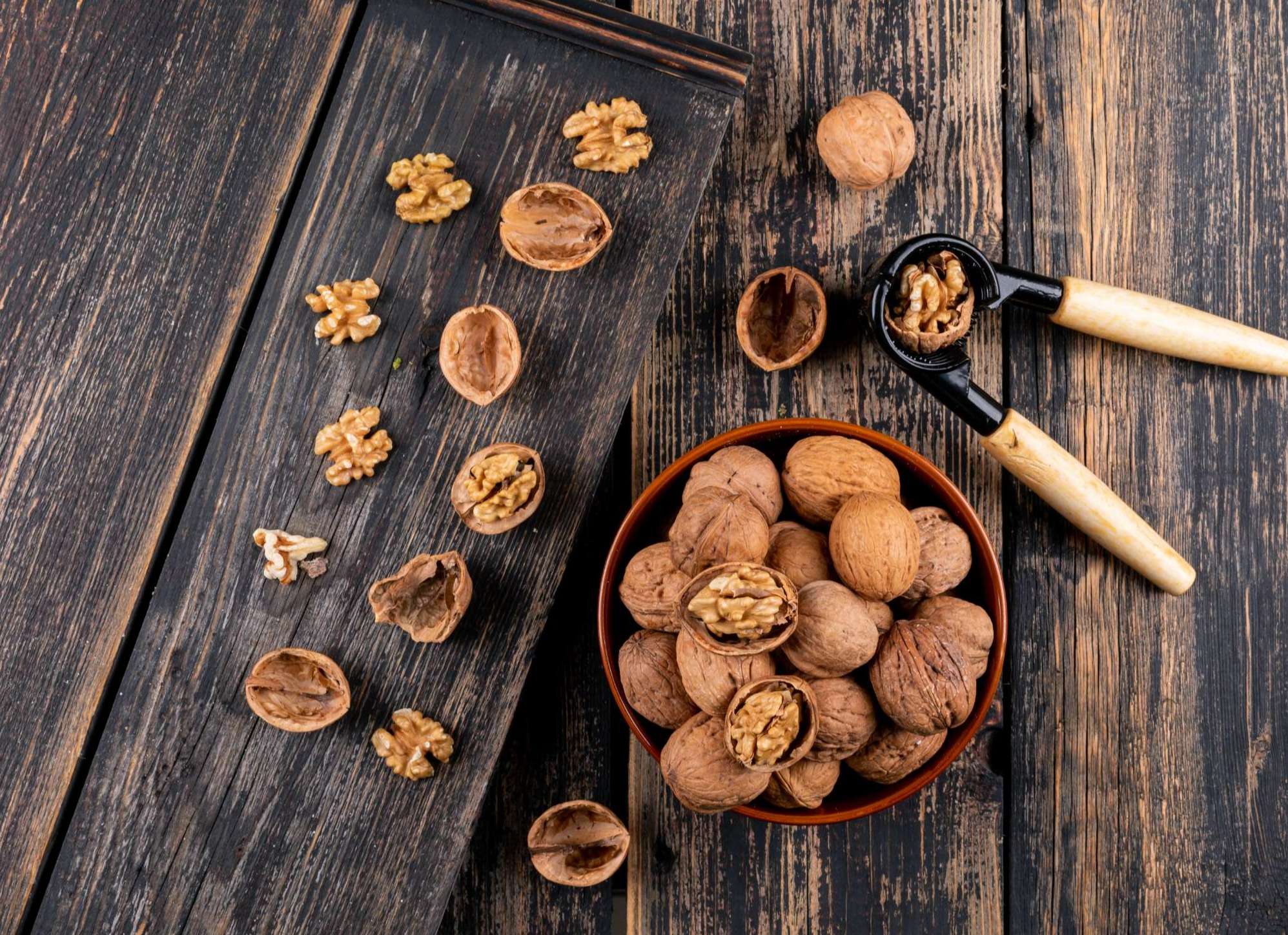 top-view-walnuts-bowl-nutcracker-wooden-horizontal_1.jpg