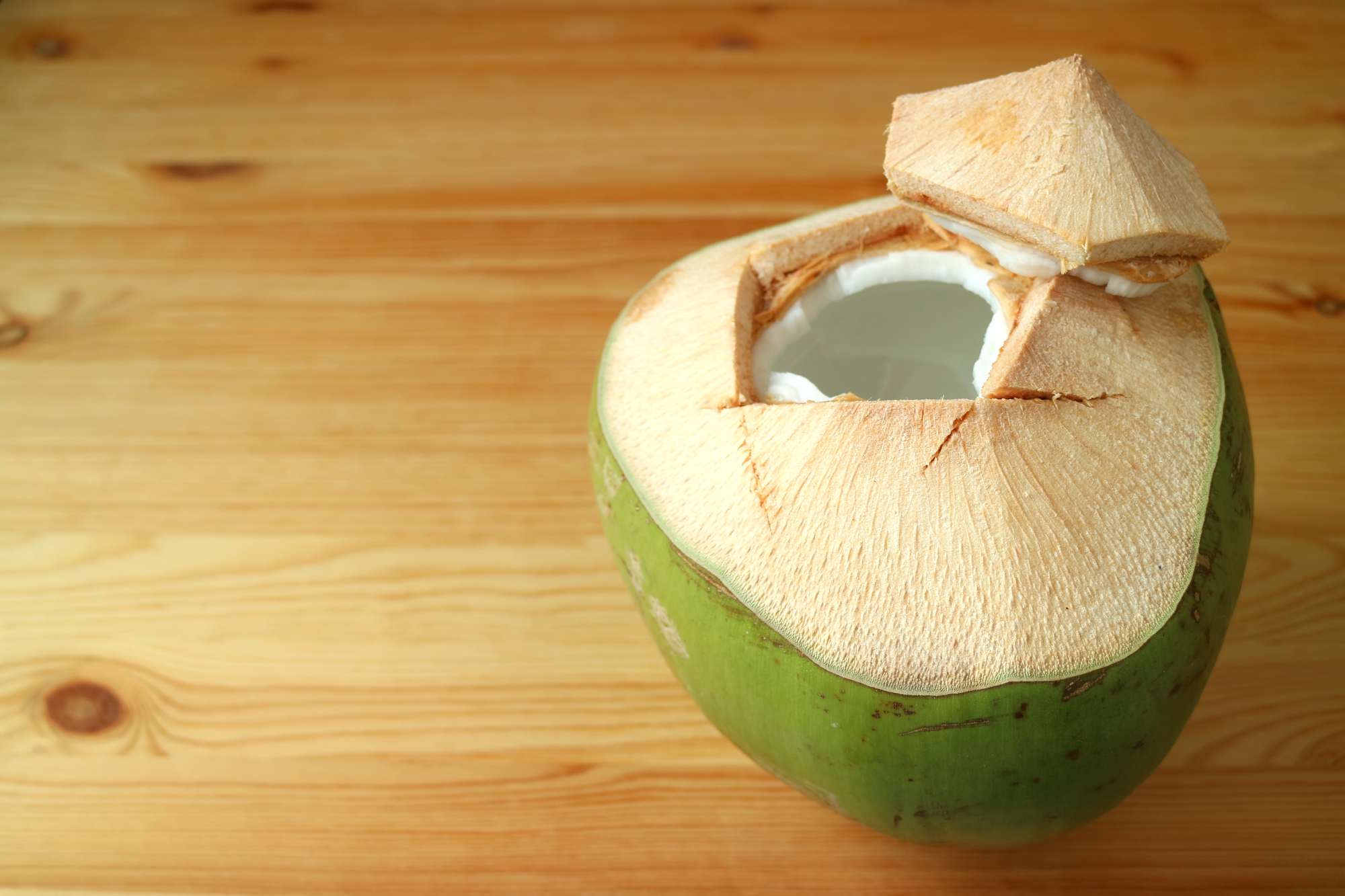 shell-opened-fresh-young-coconut-isolated-wooden-table.jpg