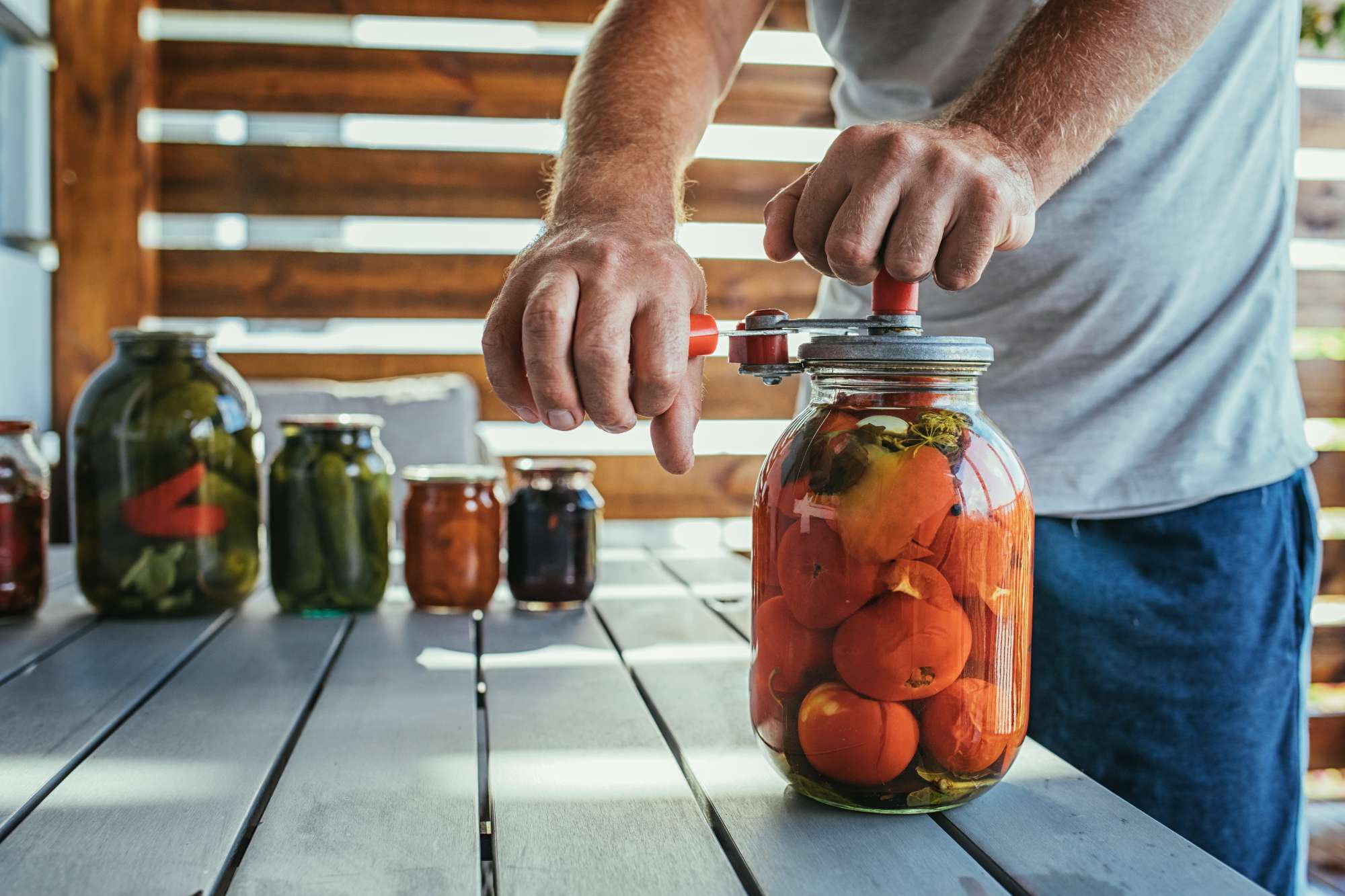 close-up-male-canning-tomatoes.jpg