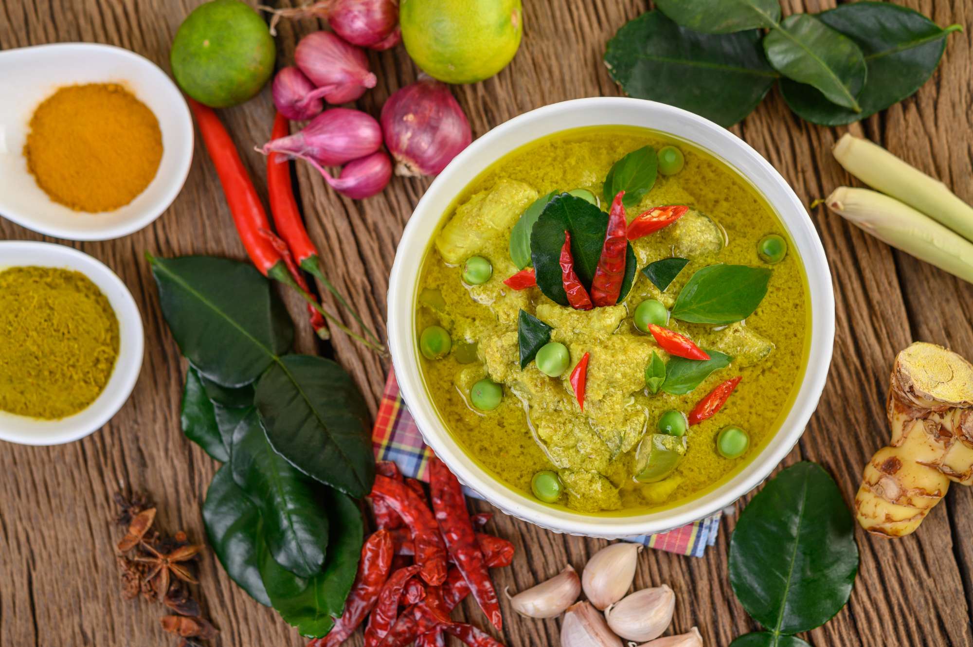 green-curry-bowl-spices-wooden-table_1.jpg