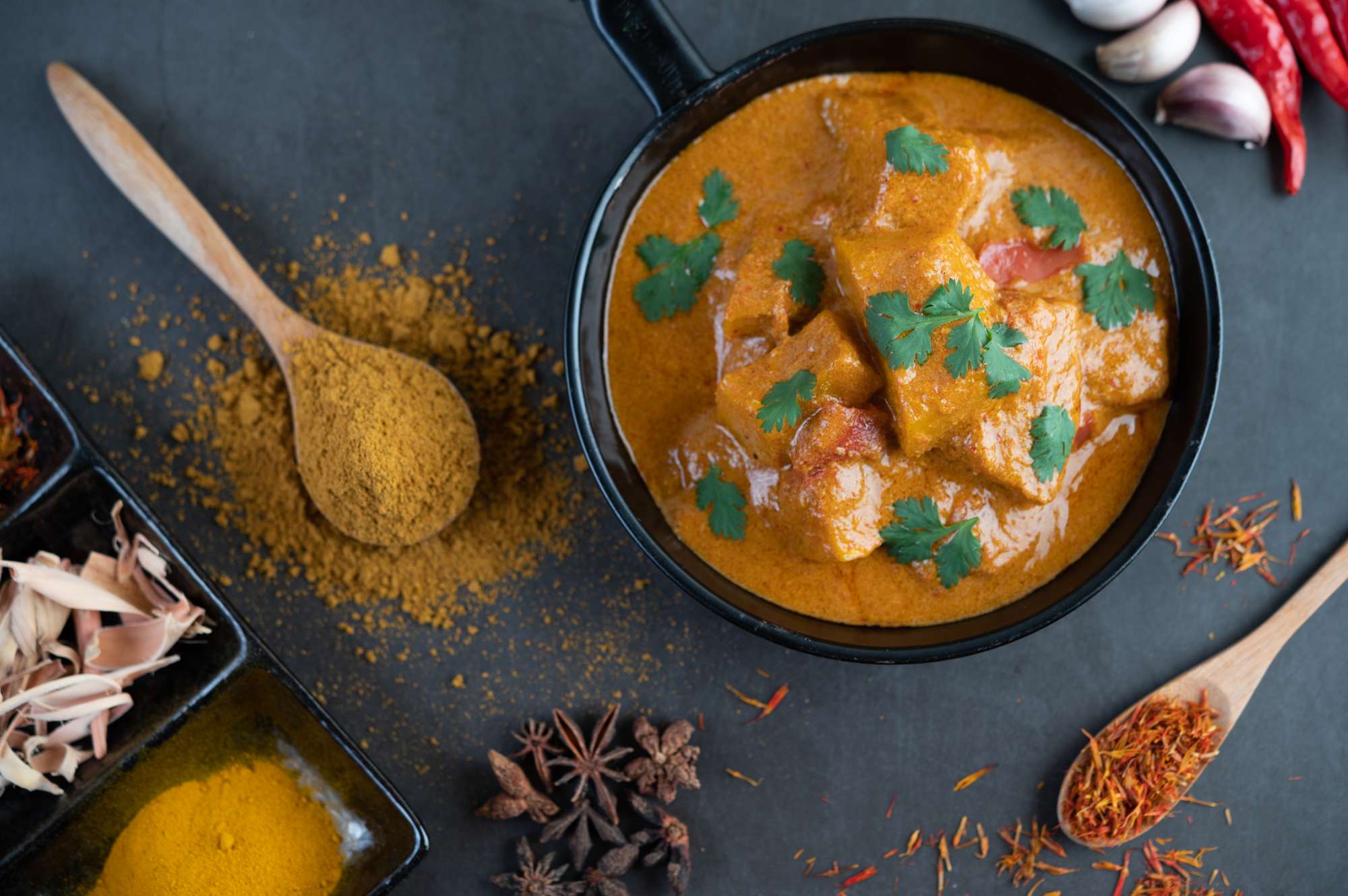 massaman-curry-frying-pan-with-spices-cement-floor.jpg