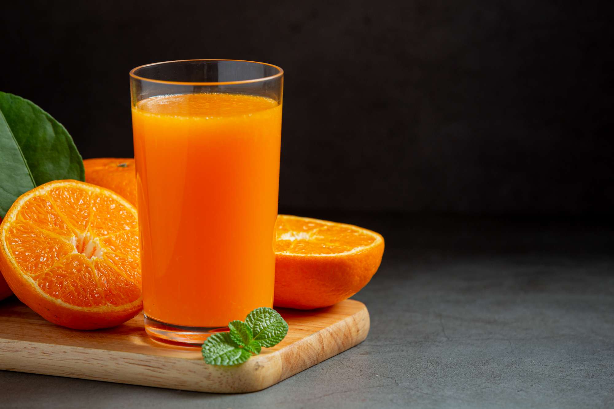 fresh-orange-juice-glass-dark-background.jpg