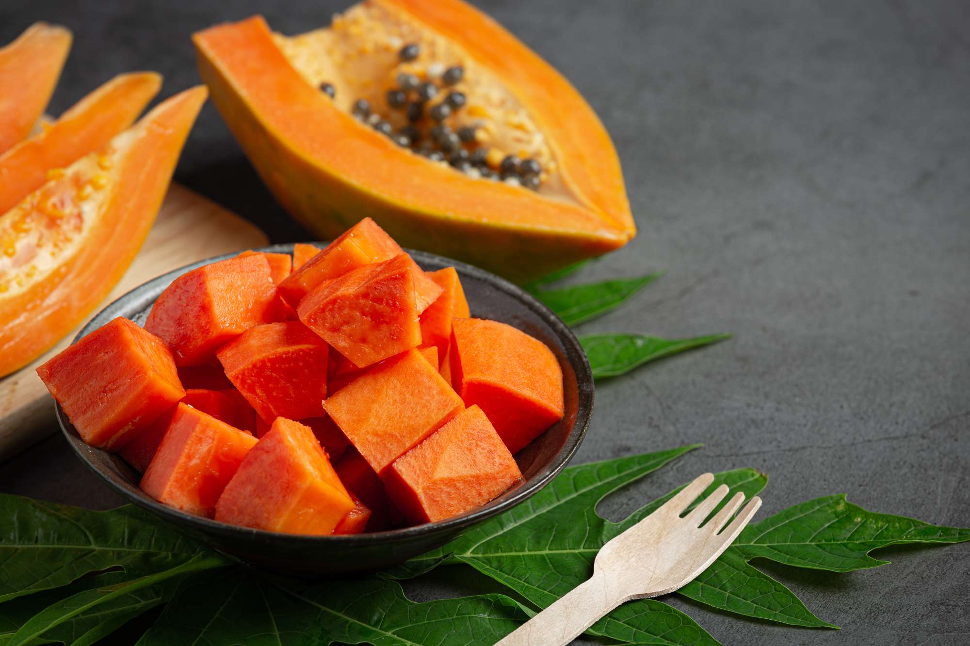 fresh-papaya-cut-into-pieces-put-black-plate.jpg