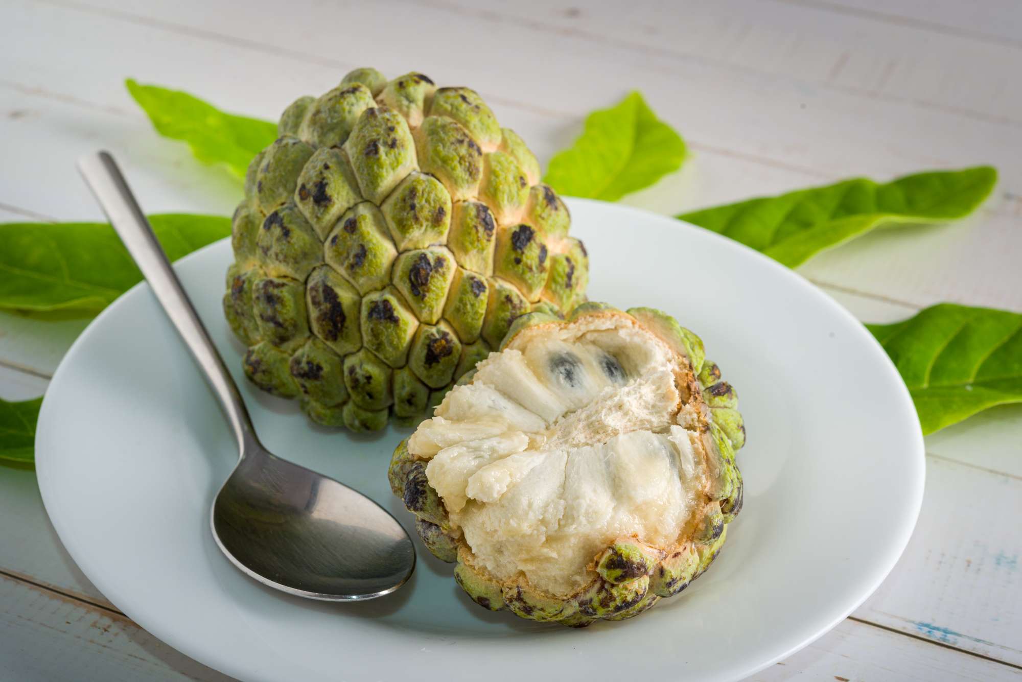 sugar-apple-white-plate-with-stainless-steel-spoon-ready-be-eaten.jpg