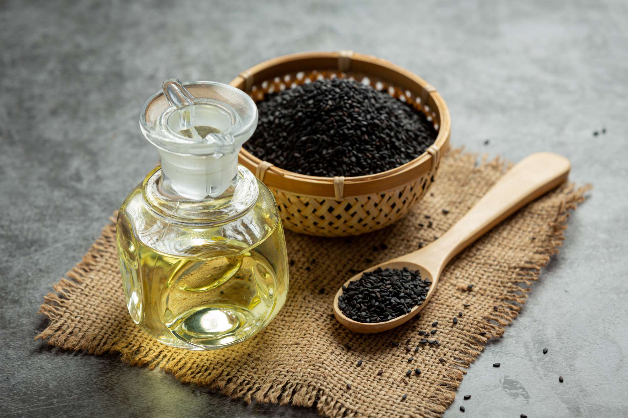 sesame-oil-raw-black-sesame-seeds-dark-background-(1).jpg