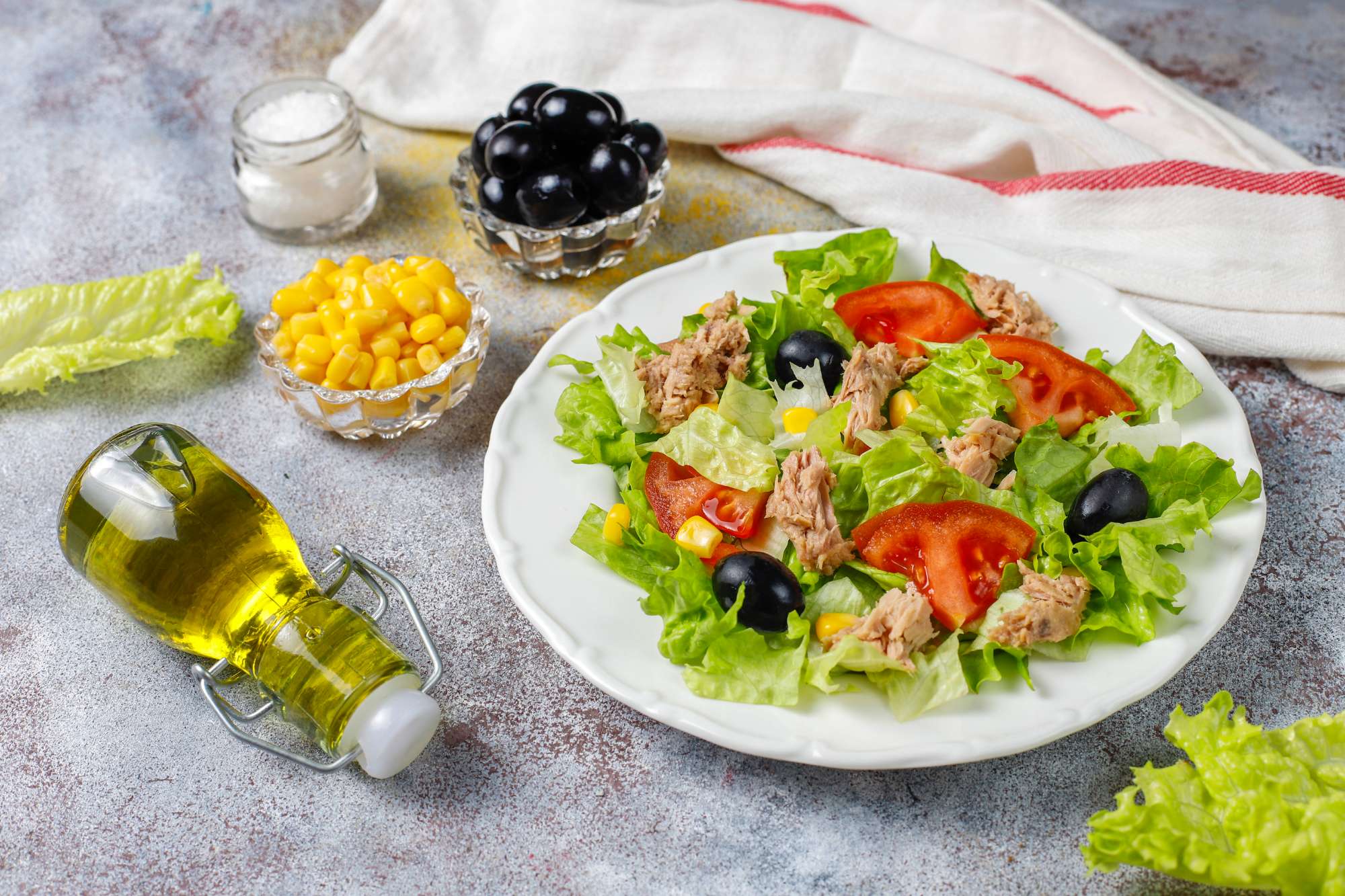 tuna-salad-with-lettuce-olives-corn-tomatoes-top-view.jpg