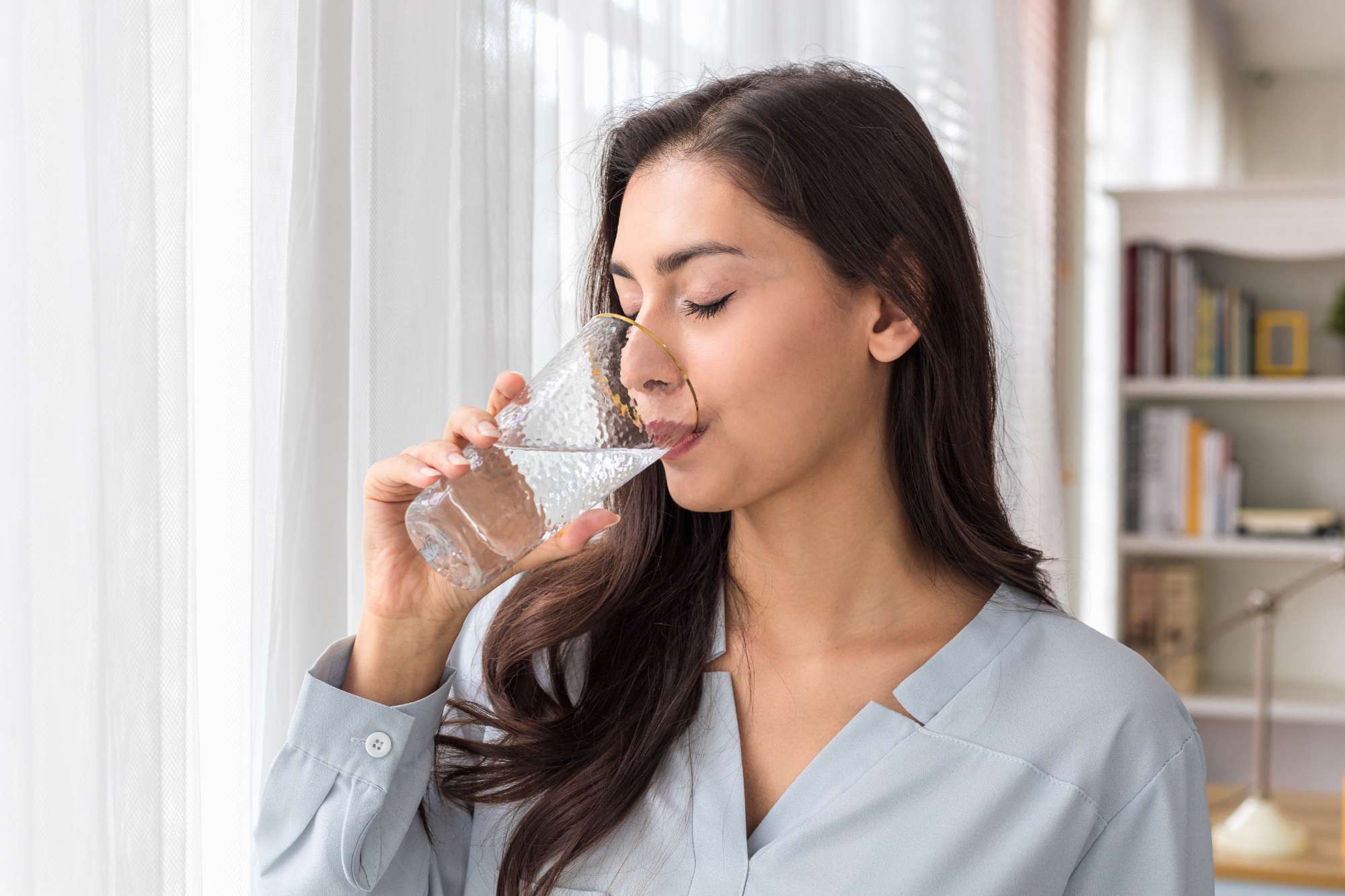 adult-caucasian-woman-drinks-glass-pure-water-morning-home.jpg