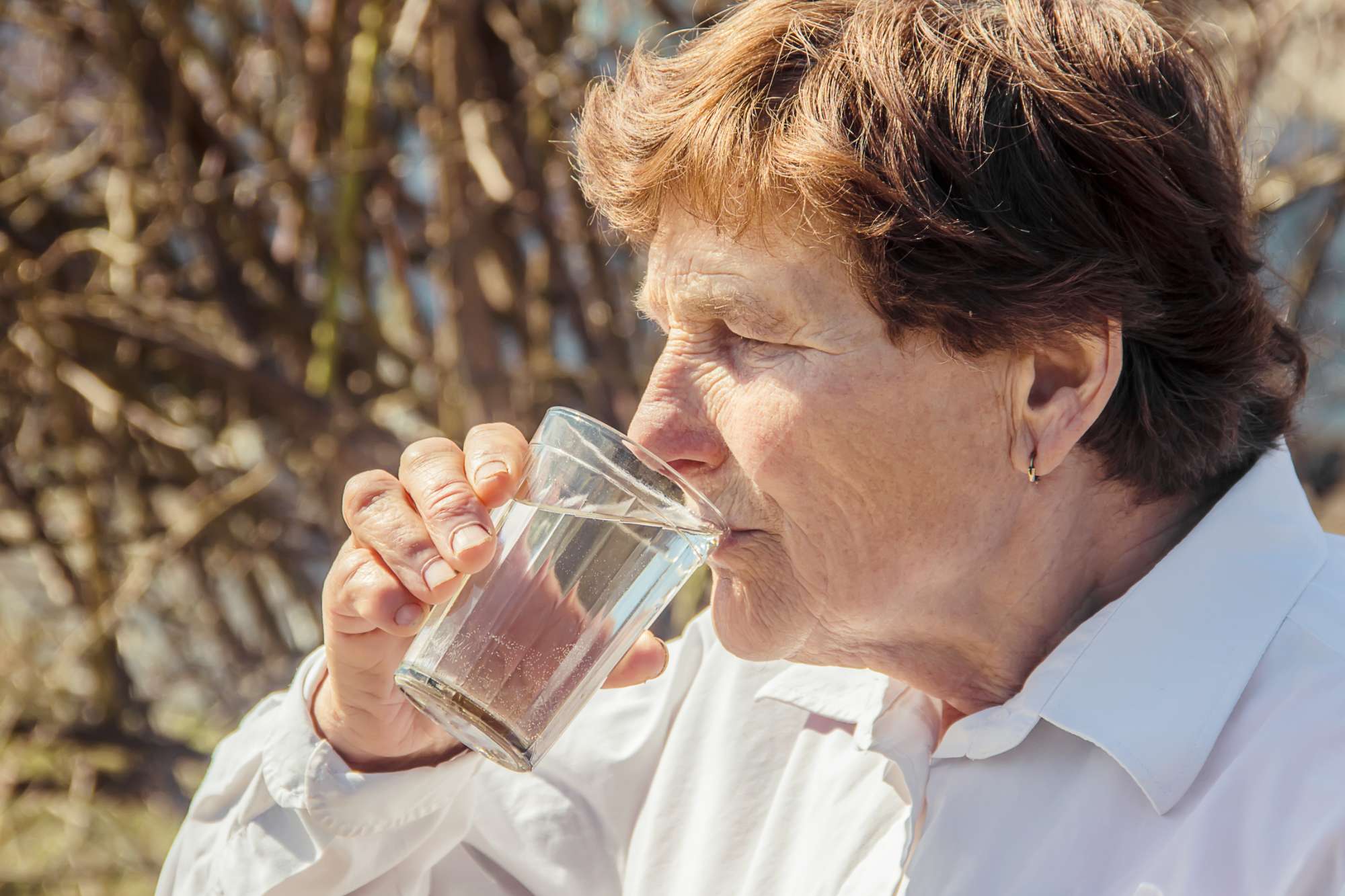 grandmother-giving-glass-clean-water-child-selective-focus.jpg