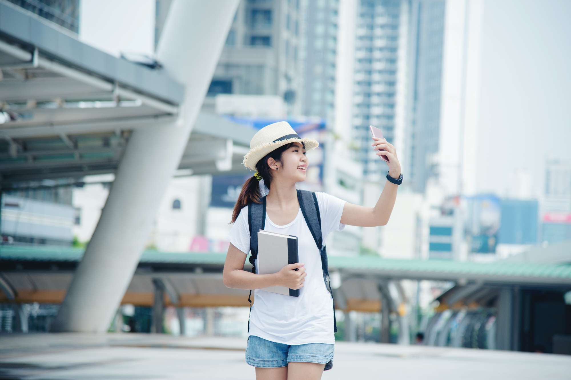 happy-smiling-asian-student-girl-with-backpack-city-background.jpg