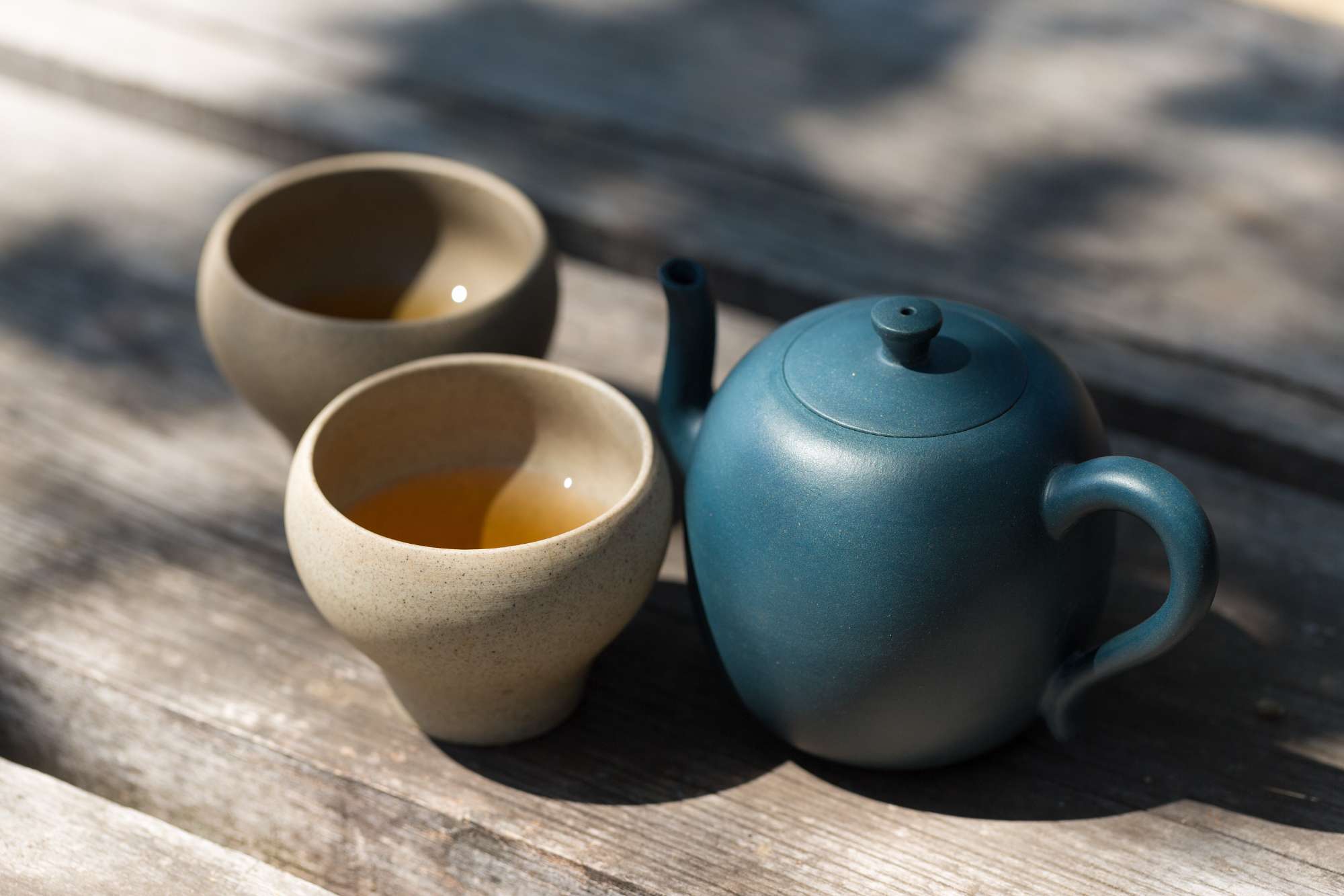 chinese-tea-ceremony-ceramic-teapot-made-clay-bowls-wooden-background.jpg