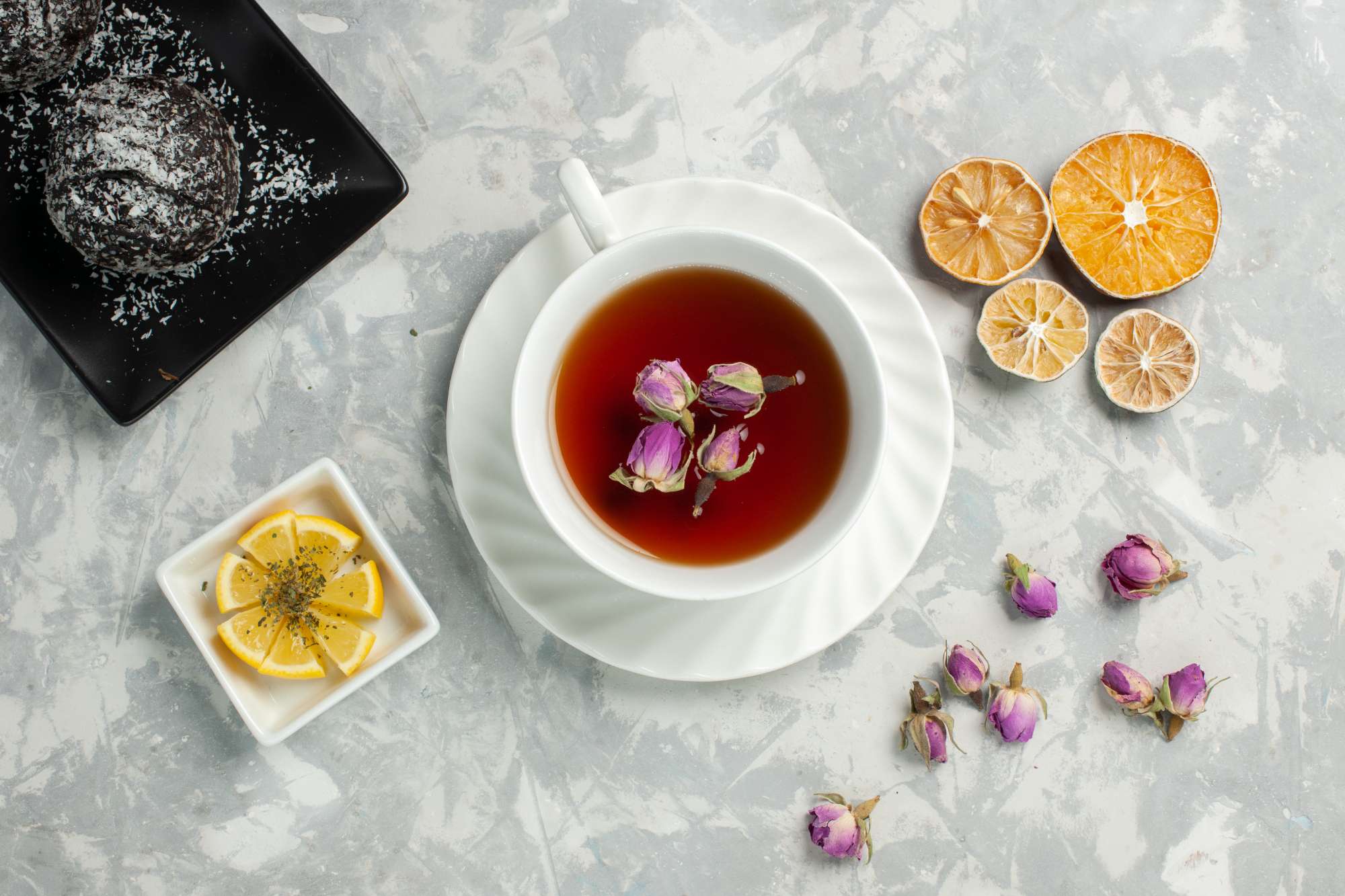 top-view-cup-tea-with-chocolate-cakes-light-white-desk.jpg