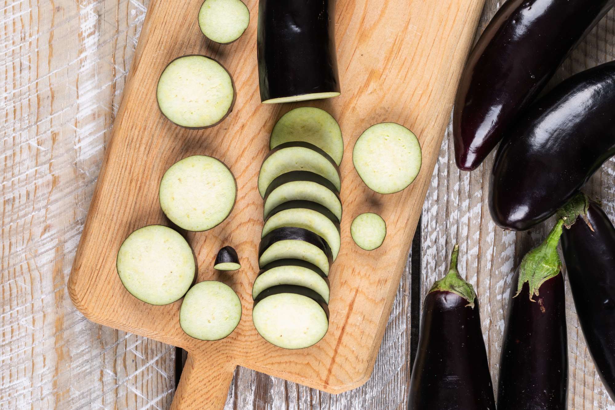 eggplants-chopped-one-cutting-board-wooden.jpg