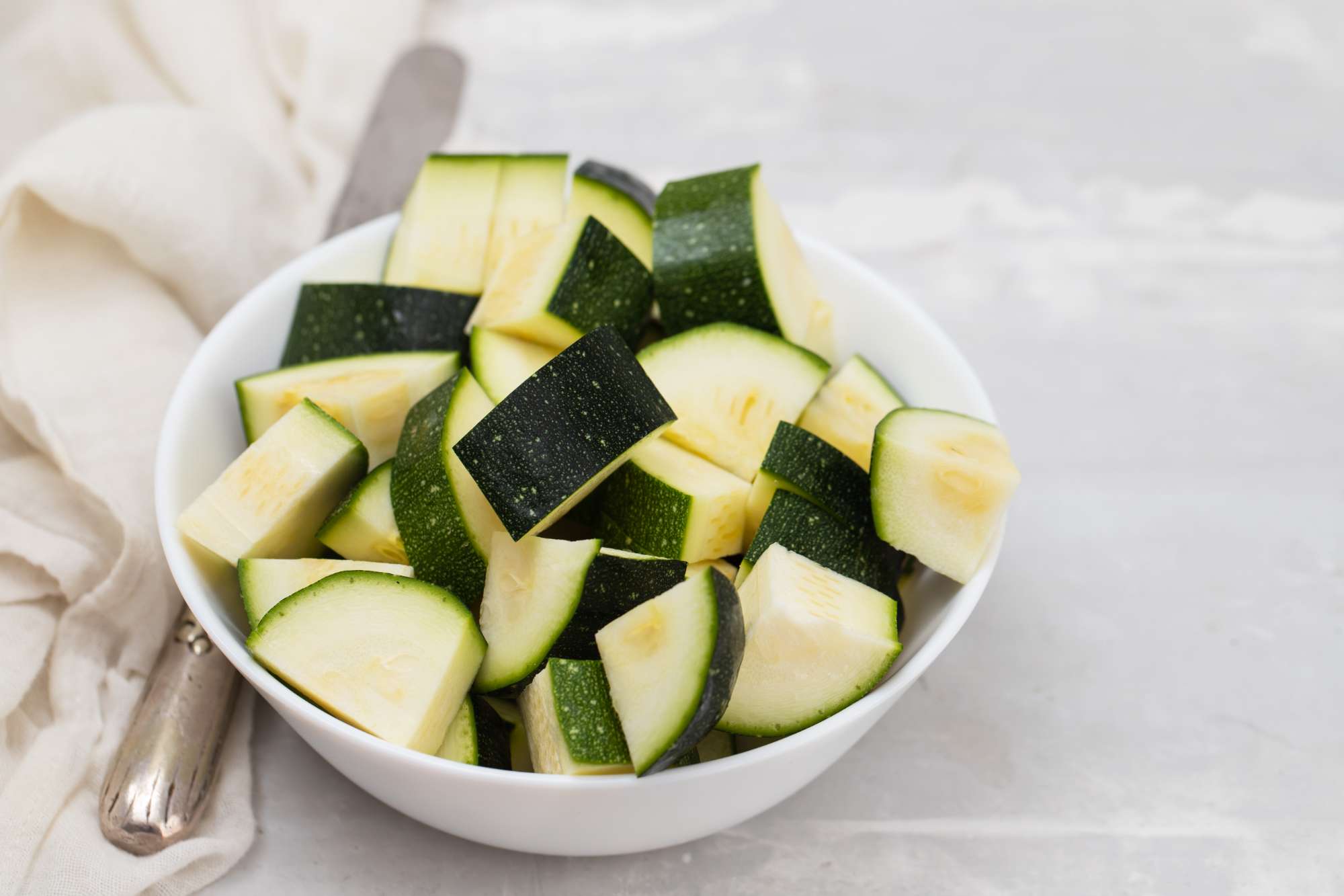 fresh-courgette-cubes-small-white-bowl-ceramic.jpg