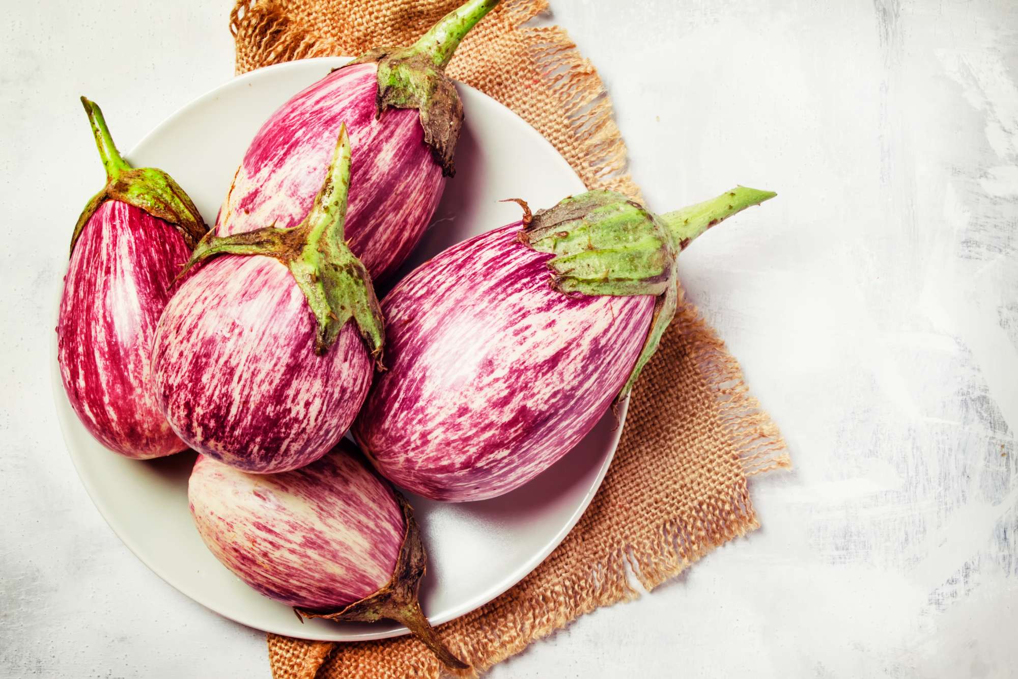 fresh-lilac-striped-eggplants-plate-top-view.jpg