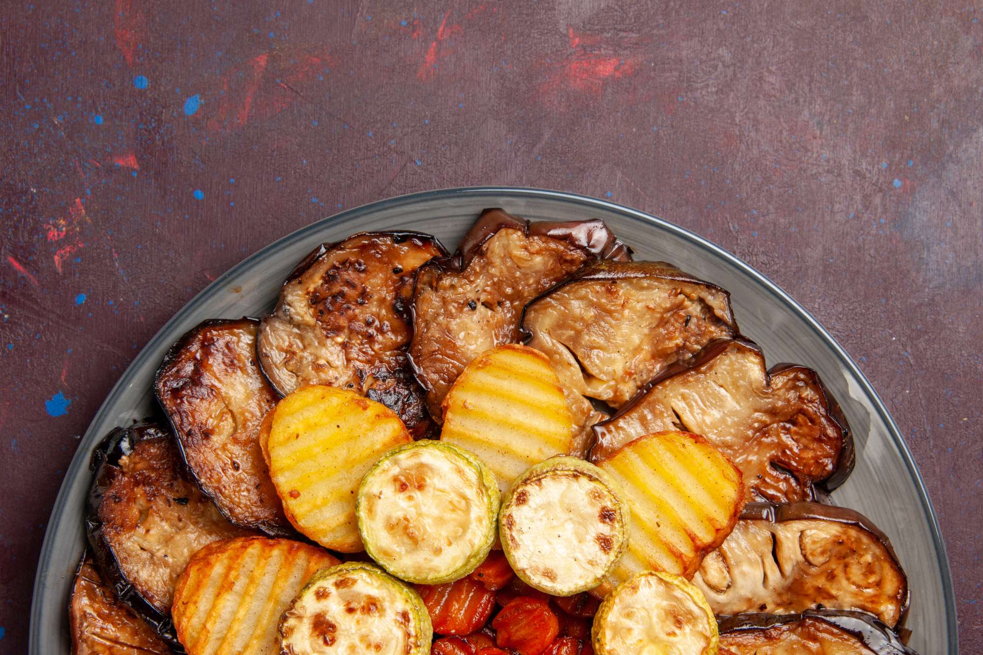 top-close-view-baked-vegetables-potatoes-eggplants-fresh-off-oven-dark-space.jpg