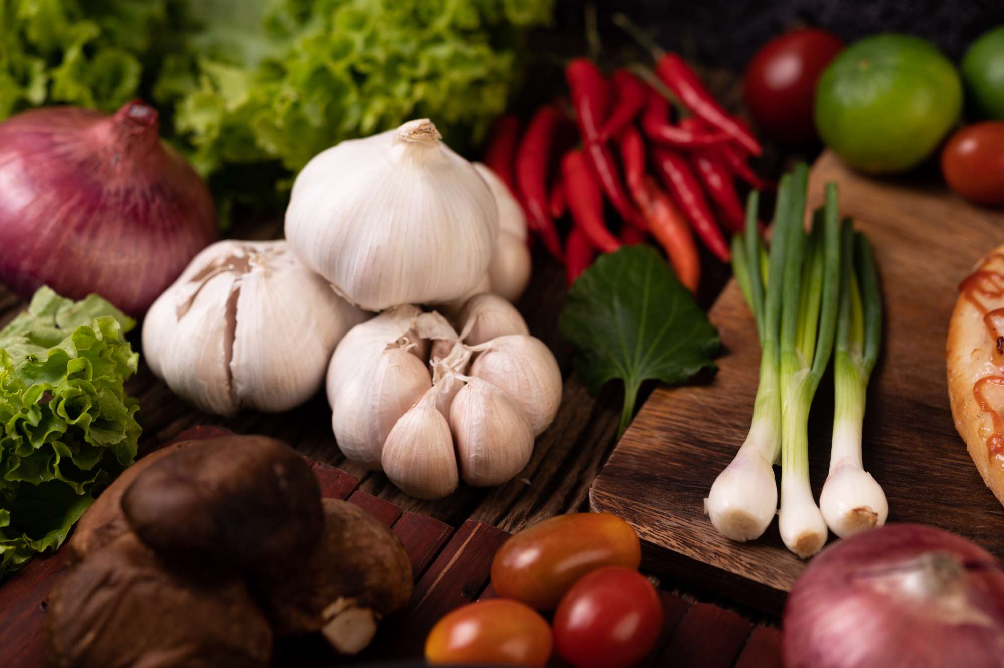 garlic-tomato-shiitake-mushroom-chili-red-onion-wooden-slats.jpg