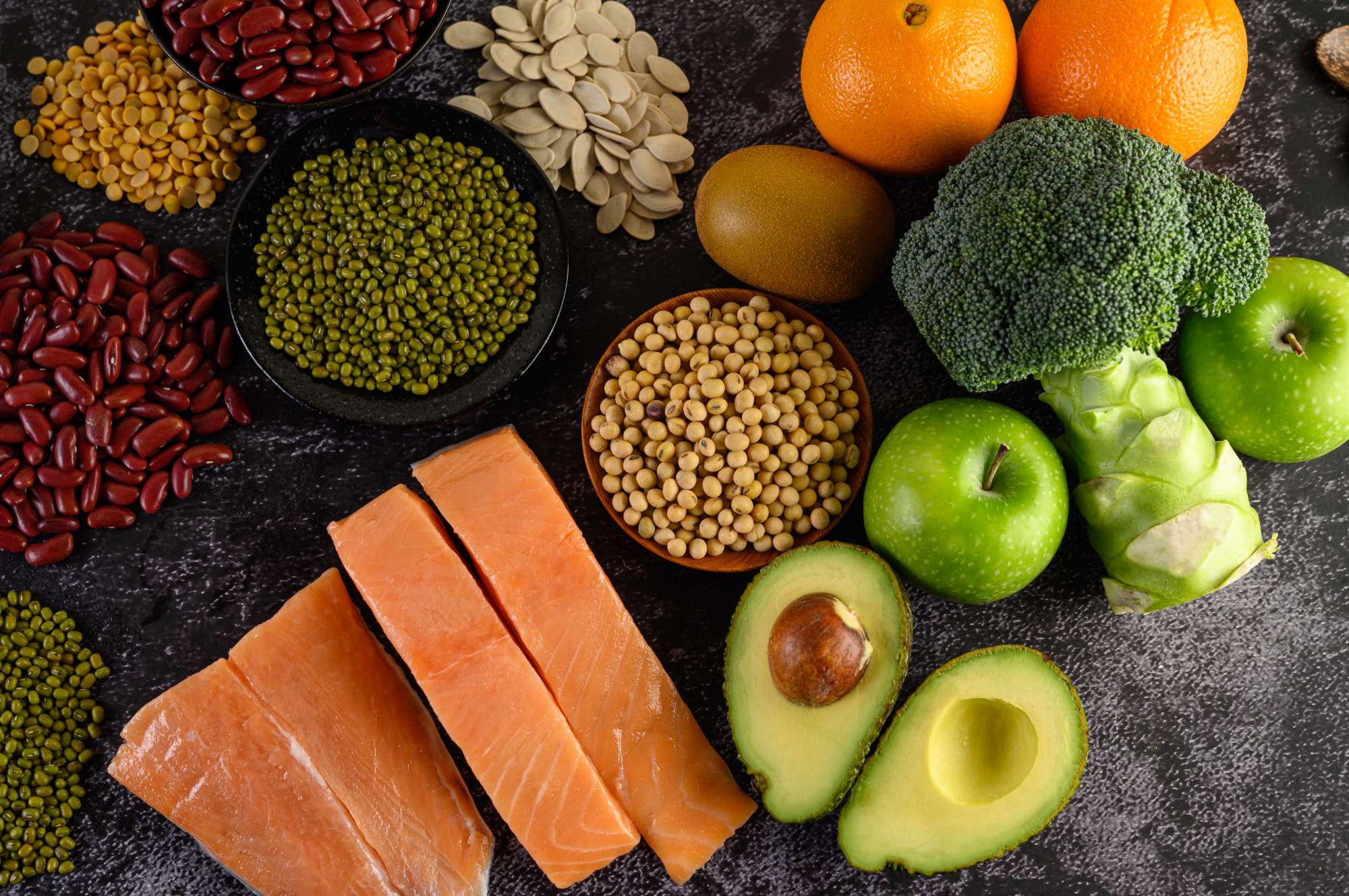 legumes-broccoli-fruit-salmon-placed-black-cement-floor.jpg